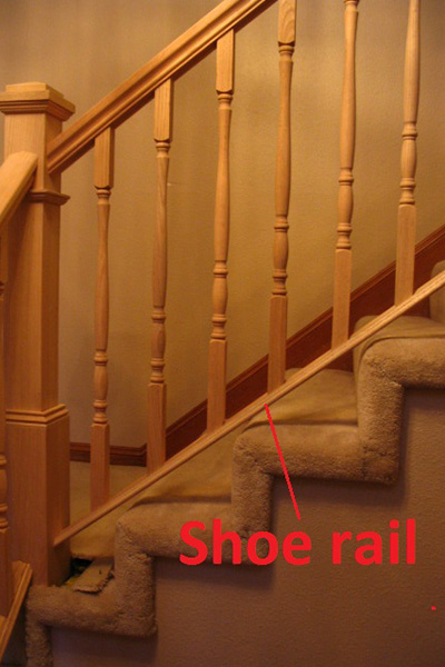Image of staircase showcasing the shoe rail at the bottom of railing