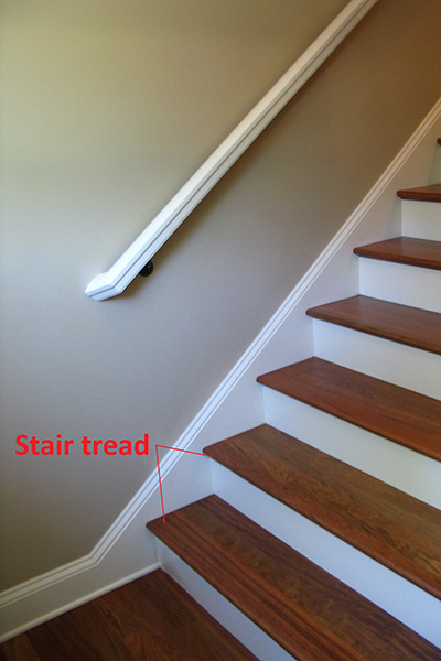 Image of staircase showcasing stair tread at base of stairs