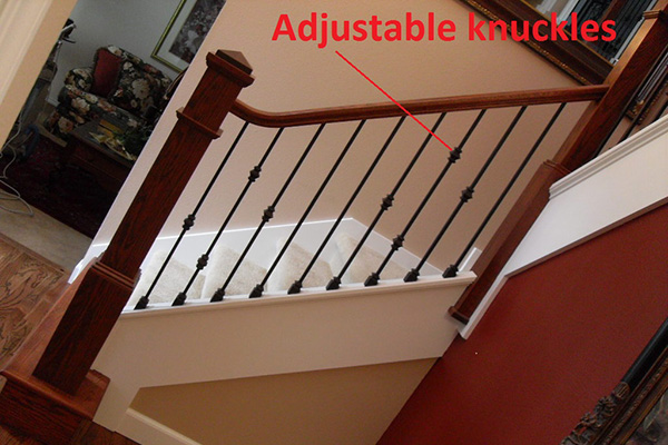 Image of staircase showcasing adjustable knuckles of a wrought iron baluster